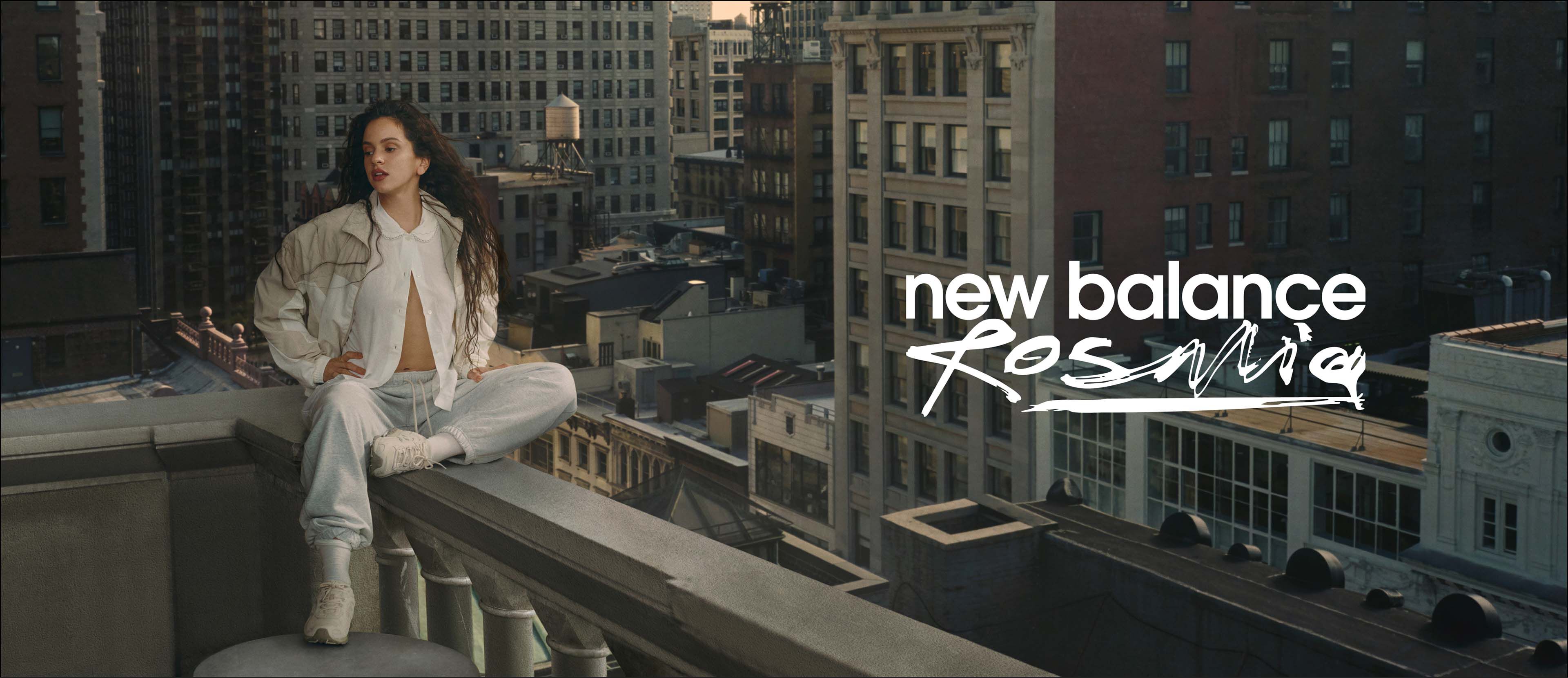 Rosal&iacute;a sitting on a balcony overlooking the city. 