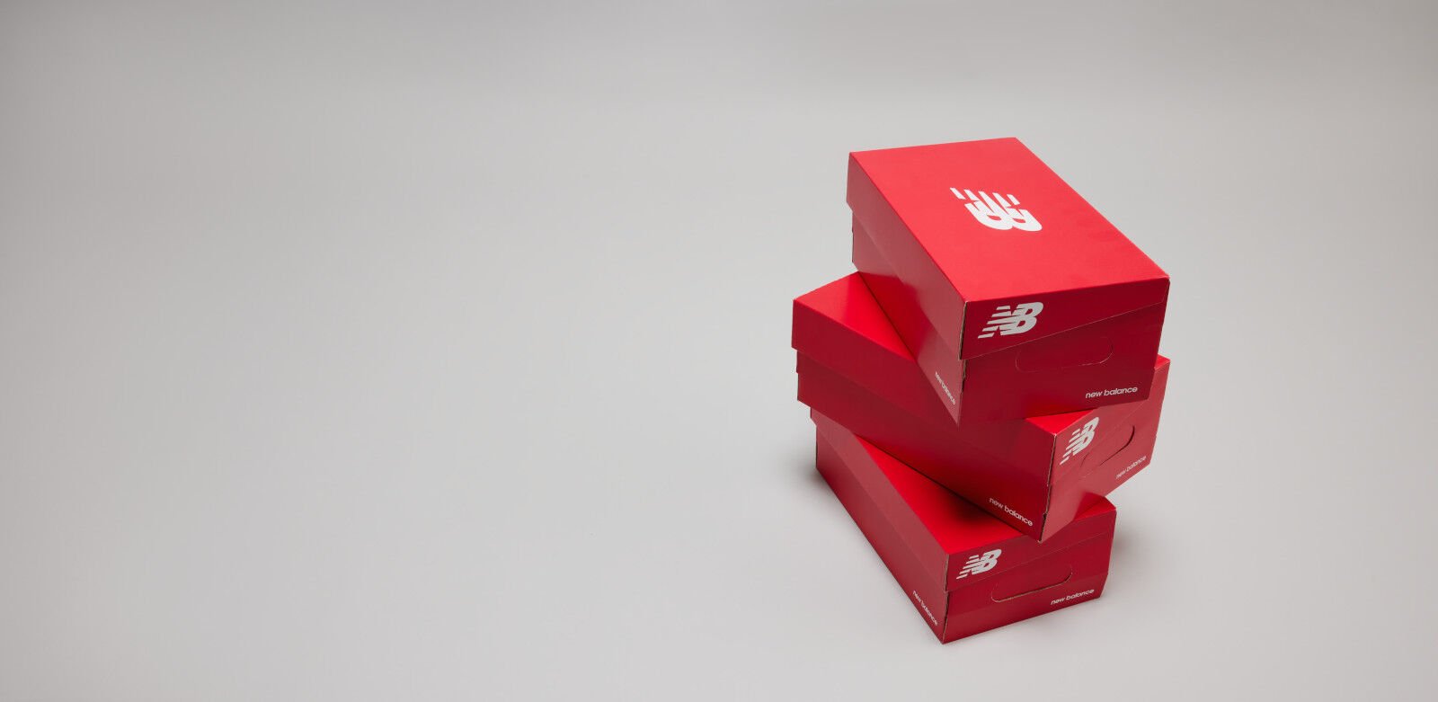 Stack of red NB shoeboxes